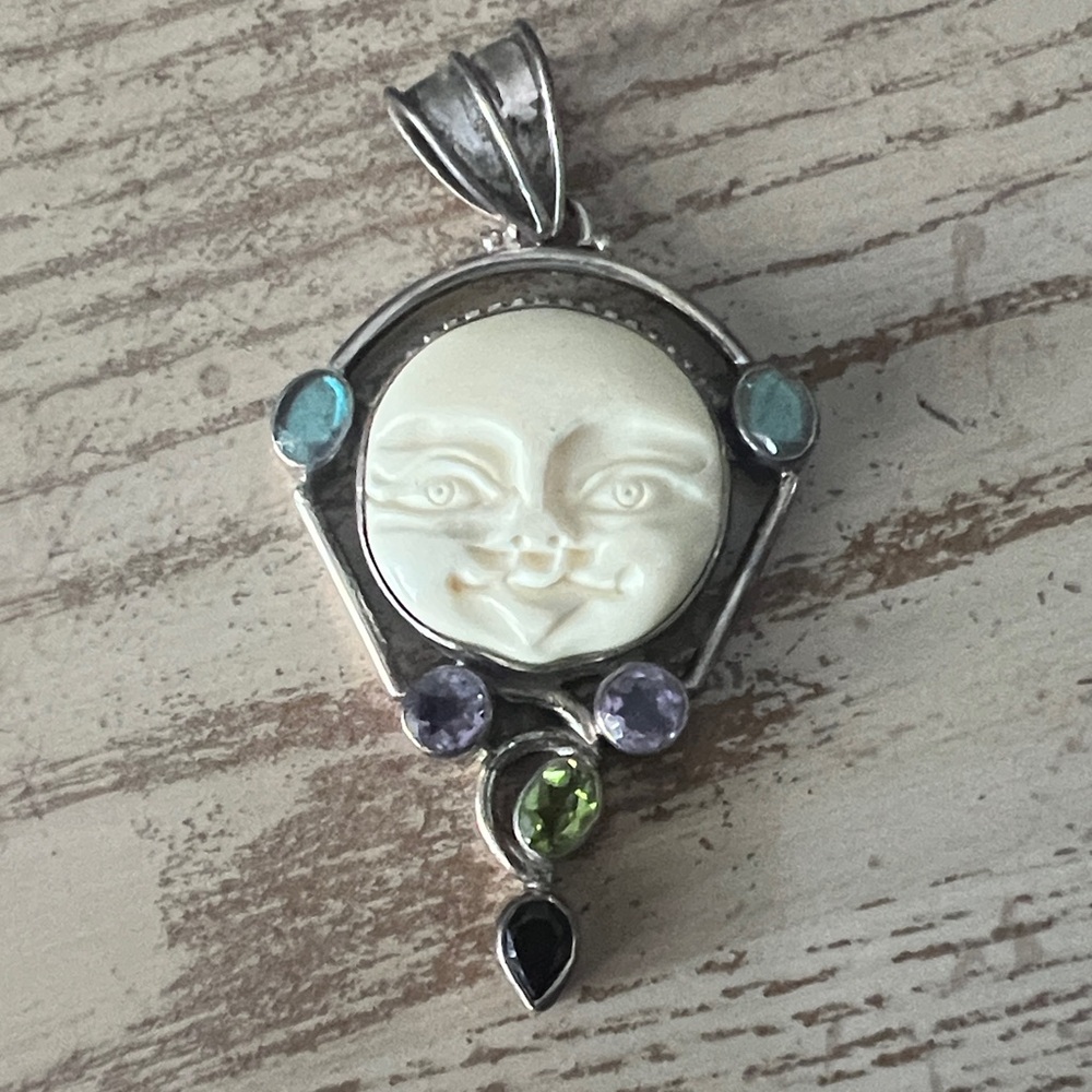 Elegant Silver Moon Face Pendant